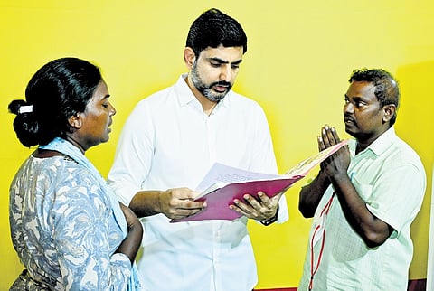 HRD Minister Nara Lokesh receives petitions from people during Praja Darbar at his residence in Undavalli on Friday I Express