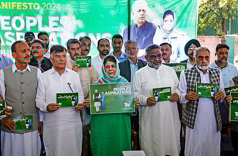 Peoples Democratic Party (PDP) President Mehbooba Mufti with other party leaders and candidates during the release of the party's election manifesto ahead of the state assembly elections, in Srinagar, Saturday, Aug. 24, 2024.