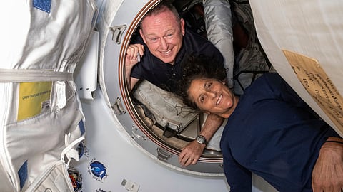 In this photo provided by NASA, Boeing Crew Flight Test astronauts Butch Wilmore, left, and Sunita Williams pose for a portrait inside the vestibule between the forward port on the International Space Station's Harmony module and Boeing's Starliner spacecraft on June 13, 2024.