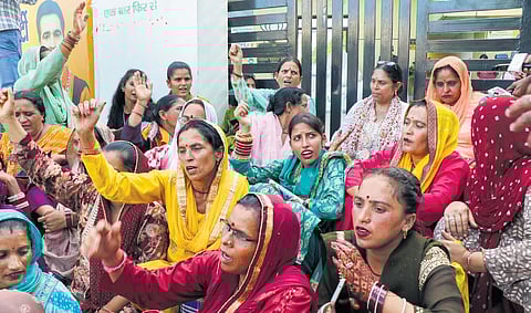 BJP workers protest after the release of first list of candidates.