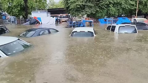 Cars seen submerged in water due to floods in Gujarat.