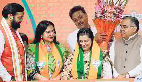 Chief Minister Nayab Singh Saini felicitates former Congress leaders Kiran Choudhry and her daughter Shruti Choudhry after joining BJP, in New Delhi.