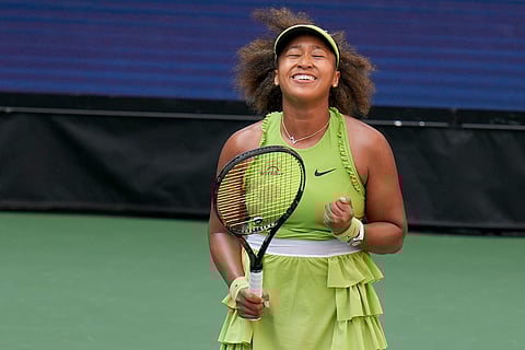Naomi Osaka, of Japan, reacts after defeating Jelena Ostapenko, of Latvia, during the first round of the U.S. Open tennis championships.