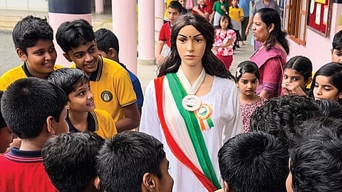 Students of Rajagiri St Chavara CMI Public School, Poochakkal surrounding Iris and asking questions