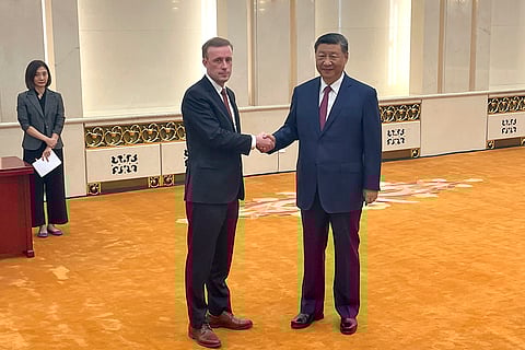 White House national security adviser Jake Sullivan, left, and Chinese President Xi Jinping shake hands at the Great Hall of the People in Beijing, China.