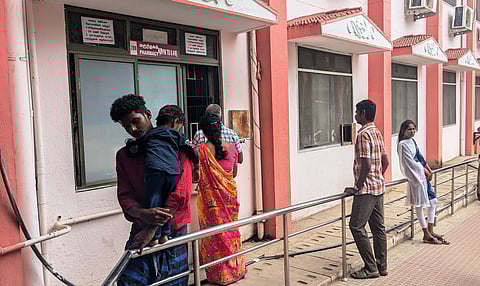 The outside pharmacy lacks seating for attendants purchasing medication for their patients.