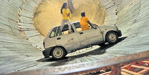 Artists performing in the ‘well of death’.