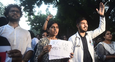 Doctors stage a protest against the alleged sexual assault and murder of a trainee doctor in Kolkata, at Jantar Mantar in New Delhi, Friday, Aug. 30.