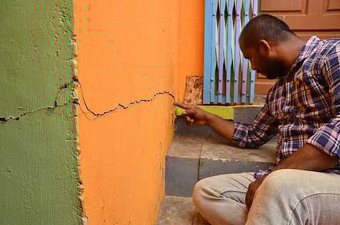 The cracks in a two-storey house.