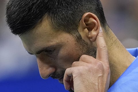 Novak Djokovic, of Serbia, reacts during a third round match against Alexei Popyrin, of Australia, of the US Open tennis championships, Friday, Aug 30, 2024, in New York