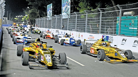 Cars line up before the practice sessions on Saturday. The start of the race got delayed due to technical issues.