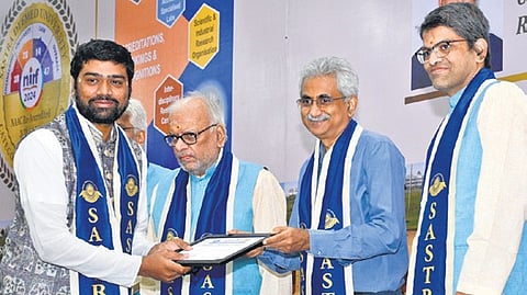 Ramco Group of Companies Chairman PR Venketrama Raja giving away certificates in the presence of Chancellor R Sethuraman and V-C S Vaidhyasubramaniam