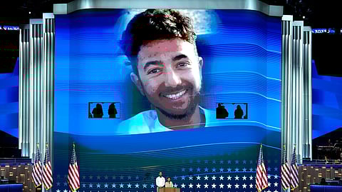 Jon Polin, left, and Rachel Goldberg, parents of Hersh Goldberg-Polin, pictured on screen speak during the Democratic National Convention.