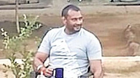 A screengrab of a video that went viral shows actor Darshan holding a mug and a cigarette in Bengaluru Central Prison