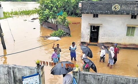 Residents of Nallela in Kuravi mandal await help after the village was flooded late on Saturday night