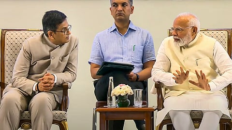 Prime Minister Narendra Modi speaks to Chief Justice of India D Y Chandrachud at the inauguration of the National Conference of District Judiciary in New Delhi.