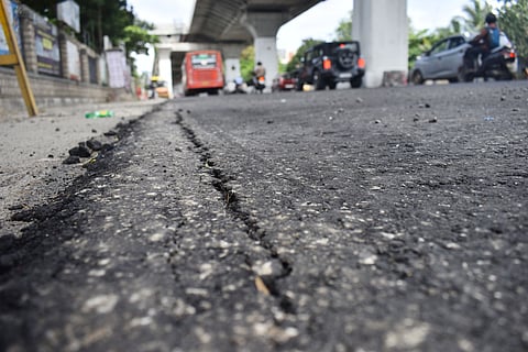 The road began developing cracks and stones started chipping away within a day of paving. (for Aravind Rajs story). Express/