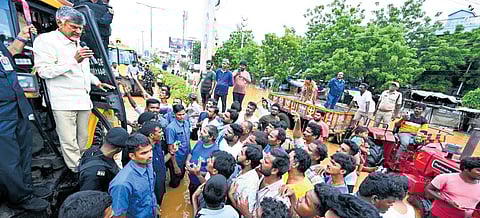 Chief Minister N Chandrababu Naidu interacting with flood-affected residents in Vijayawada on Tuesday