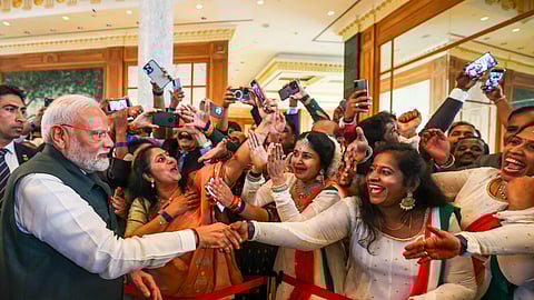 Prime Minister Narendra Modi being welcomed by members of the Indian community upon his arrival at a hotel, in Brunei.