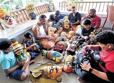 A team of Kummattikkali artists working on masks ahead of Onam