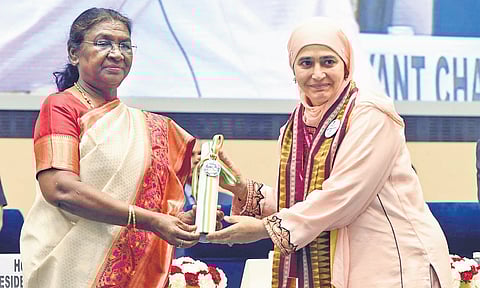 President Droupadi Murmu felicitates a teacher during the National Teachers’ Awards function in New Delhi on Thursday.