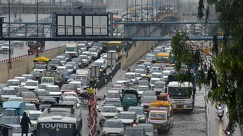 Massive traffic Jam due to waterlogging after heavy rains at Ghazipur, in East Delhi on Wednesday.