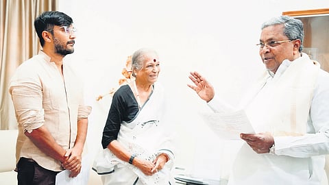 Journalist Vijayamma and actor Chetan Ahimsa with Chief Minister Siddaramaiah at his official residence ‘Cauvery’ in Bengaluru on Thursday