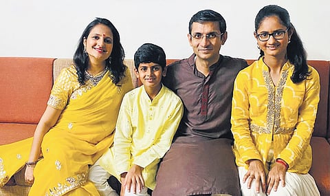 Krisha (right) with her parents and brother