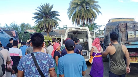 Locals are gathered around an ambulance in the aftermath of a rocket attack in Moirang, Manipur, on Friday, Sept 6, 2024.