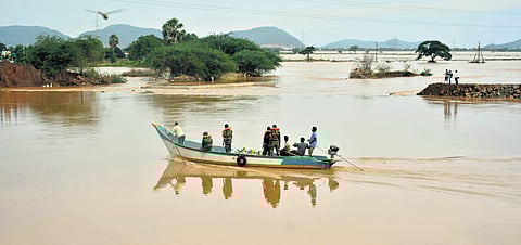 Army personnel of the 6th Madras regiment arrive at the point where Budameru Rivulet developed a breach at Shantipuram near Kondapalli on Friday