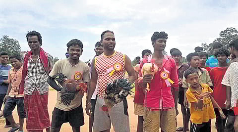 The winners with their roosters