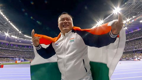 India's Hokato Hotozhe Sema celebrates after winning bronze medal in men's shot put F57 final event of the Paris Paralympics 2024.