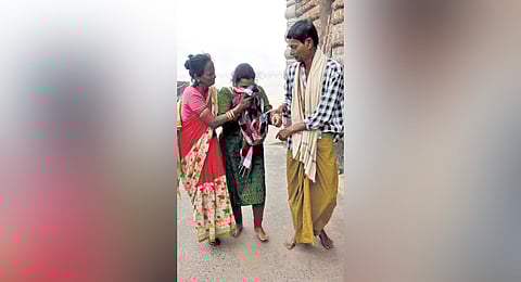 Behera and his wife Tukuni consoling a woman they rescued in Cuttack