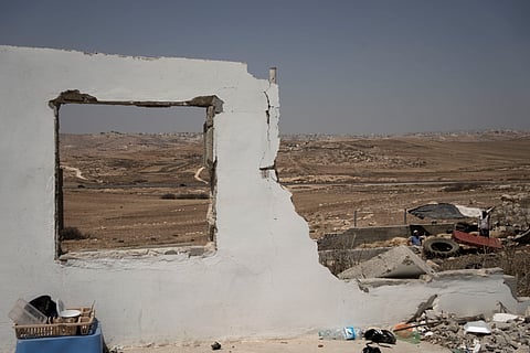 The ruins of a home in the West Bank village of Khirbet Zanuta, destroyed when residents were driven out by Israeli settlers, Tuesday, Aug. 27, 2024.