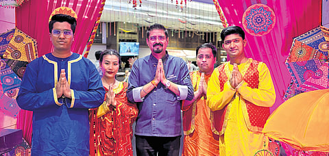 Executive Chef Rakesh Singh Rana (centre) with traditionally dressed staff at Pride Plaza Hotel’s food festival