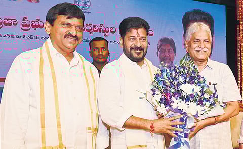 Telangana Media Academy chairman K Srinivas Reddy greets Chief Minister A Revanth Reddy at Ravindra Bharathi in Hyderabad on Sunday