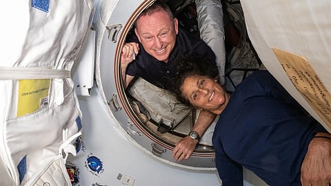 This undated handout picture from Nasa released on July2, 2024 shows NASA’s Boeing Crew Flight Test astronauts (from top) Butch Wilmore and Sunita Williams inside the vestibule between the forward port on the International Space Station’s Harmony module and Boeing's Starliner spacecraft.