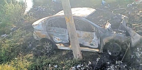 The car rammed the parapet of a bridge on Annur-Mettupalayam Road and an EB post on Monday night. The driver was trapped inside