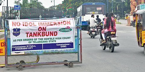 Banners preventing the immersion of Lord Ganesha idols in Hussainsagar put up along the Tank Bund stretch in the city on Tuesday