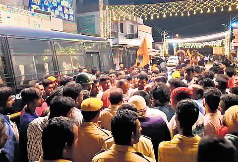 Police try to pacify the crowd in Nagamangala on Wednesday night