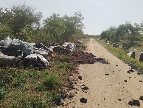 Waste cotton dumped along the PAP canal at Veppampalayam in Vellakovil in Tiruppur district.