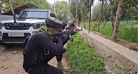 Security personnel during an encounter with militants at Chak Tapper Kreeri Pattan area, in Baramulla district, Jammu and Kashmir, Saturday, Sept. 14, 2024.