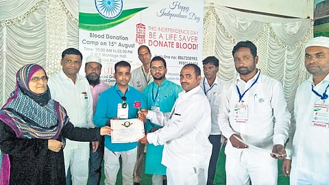 A blood donor being honoured in Vijayapura