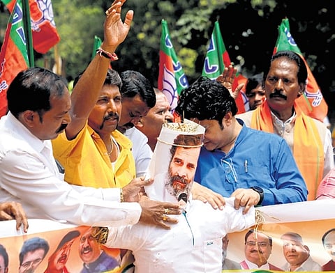 BJP workers protest against Congress MP Rahul Gandhi in Bengaluru on Saturday