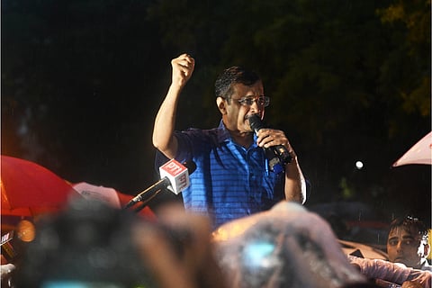 Delhi Chief Minister Arvind Kejriwal addresses supporters outside Tihar Jail after the Supreme Court granted him interim bail in a corruption case lodged by the CBI in connection with the excise policy scam, in New Delhi on Friday.