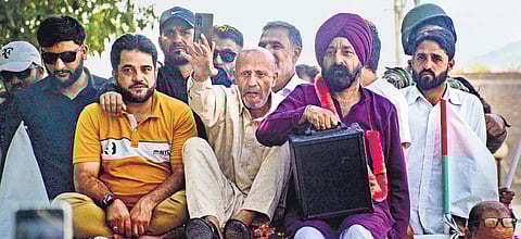 AIP chief Er Rashid during a roadshow ahead of J&K Assembly elections, at Tral constituency in Pulwama district of Jammu and Kashmir on Sunday.