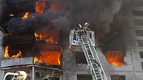 Flames rise after a Russian aerial bomb struck a multi-story residential building in Kharkiv, Ukraine.