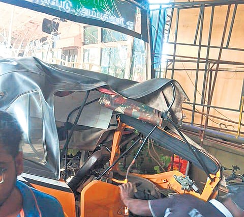 The bus driver swerved to avoid a biker, lost control and the bus fell into the service road 10-15 feet below