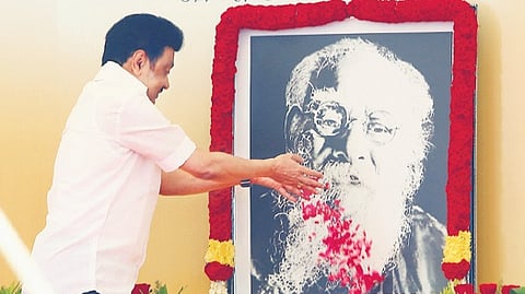 CM Stalin paying floral tributes to the portrait of Periyar.