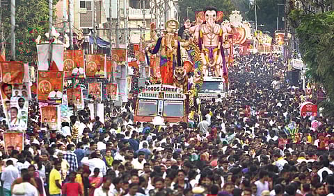 A procession of Ganesh idols near Moazzam Jahi Market on the way to Hussainsagar for immersion in Hyderabad on Tuesday